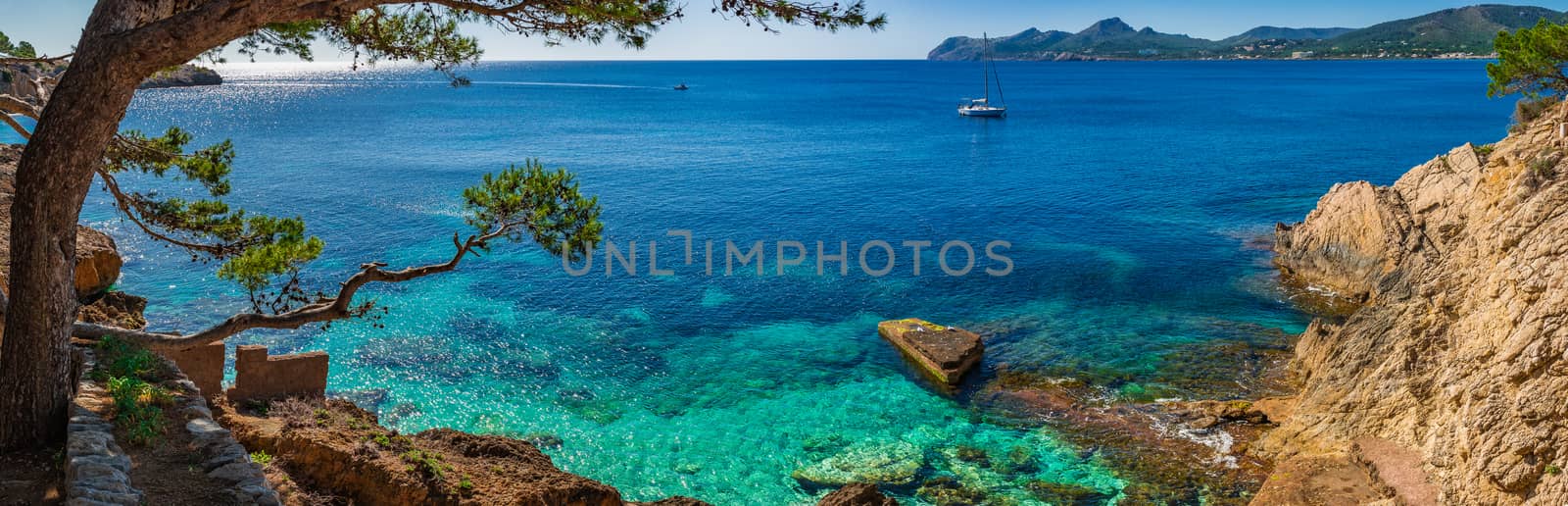 Idyllic island panorama scenery, sailboat at the coast of Majorca, Spain Mediterranean Sea by Vulcano