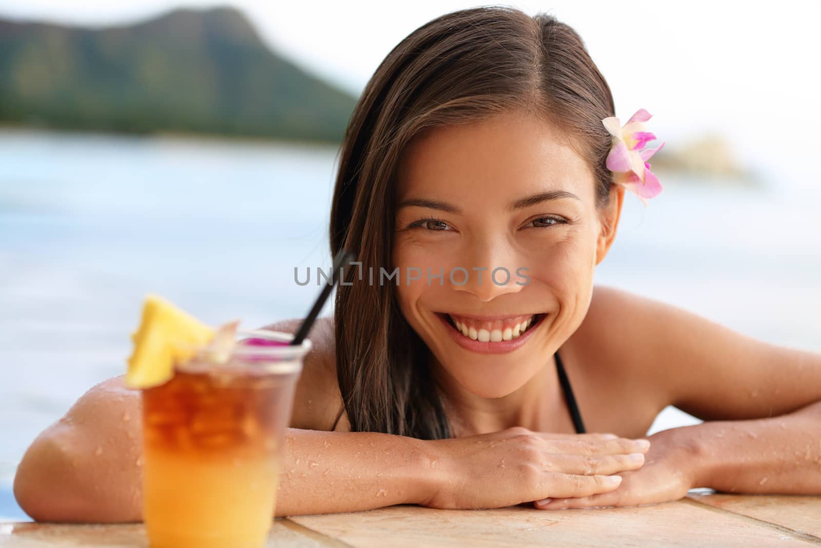 Hawaii woman with hawaiian Mai Tai drink on beach by Maridav