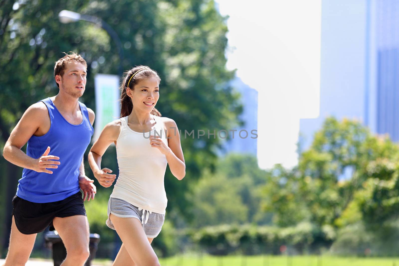 Runners jogging in New York City Central Park, USA by Maridav