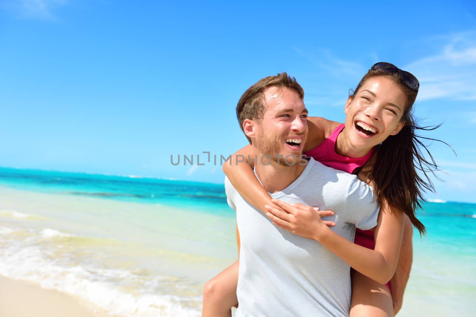 Happy couple in love on beach summer vacations by Maridav