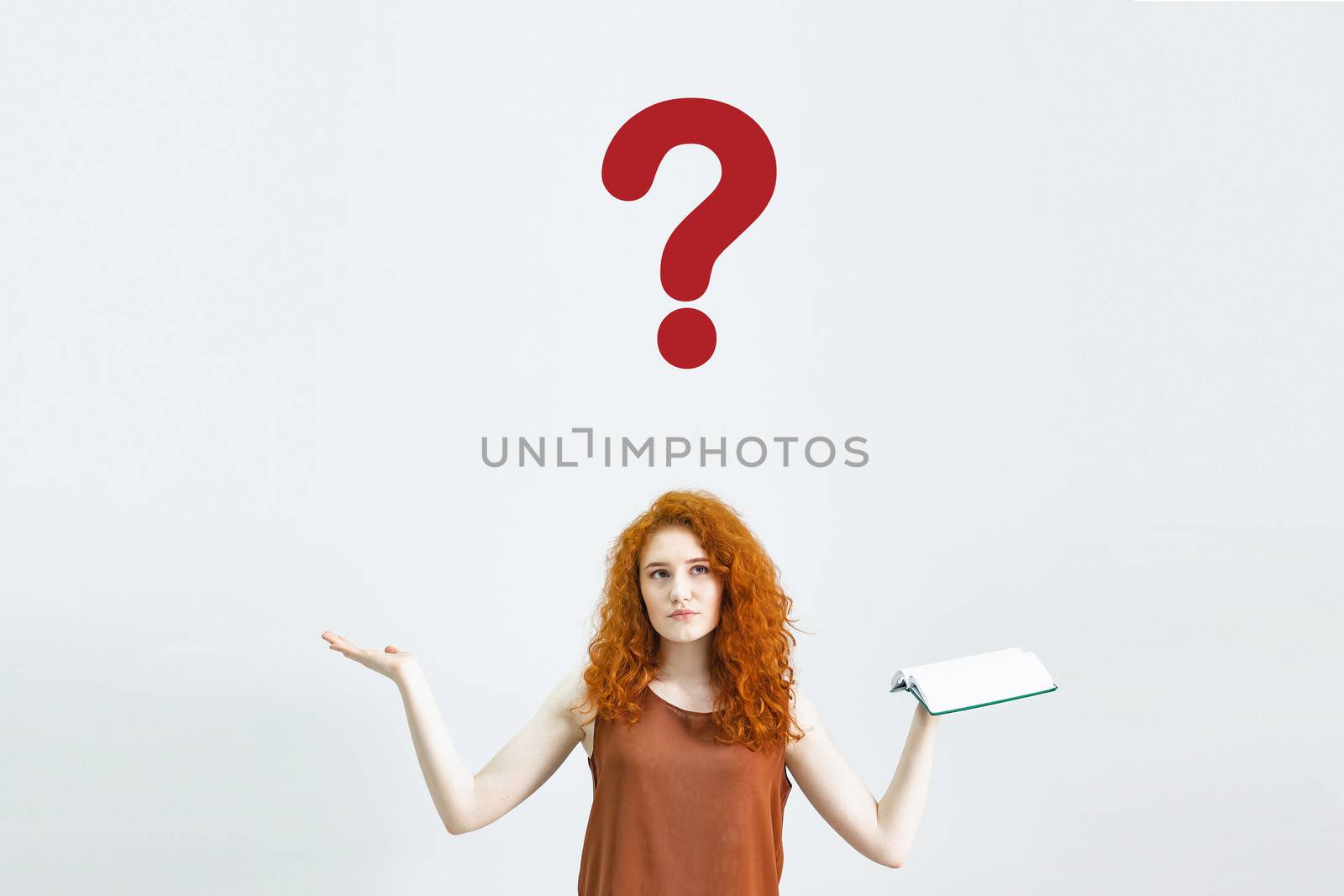 A Studio portrait of a sweet, puzzled, indecisive young woman shrugs, not understanding what happened. A rather attractive woman doubts in isolation on a white background by Pirlik
