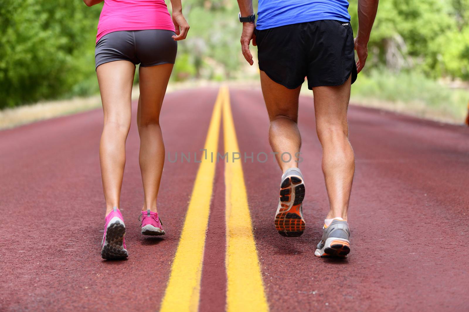 Running people - runners jogging shoes and legs by Maridav