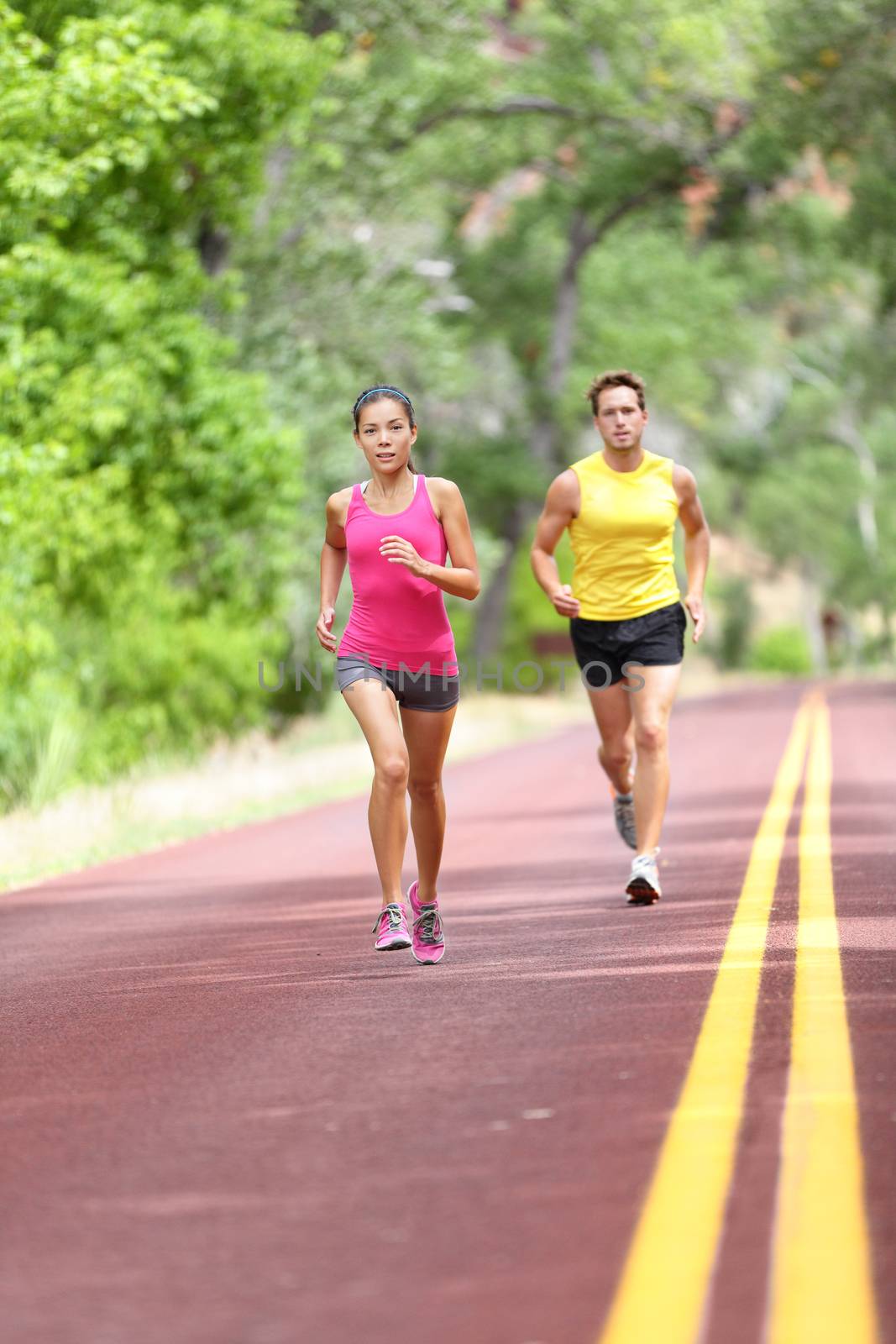 People running on road - Sport and fitness runners by Maridav