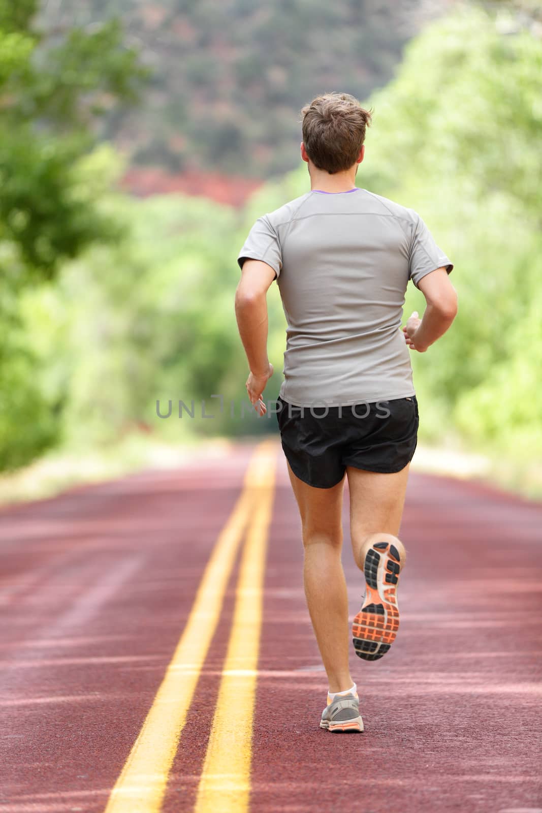 Running man runner working out for fitness jogging by Maridav