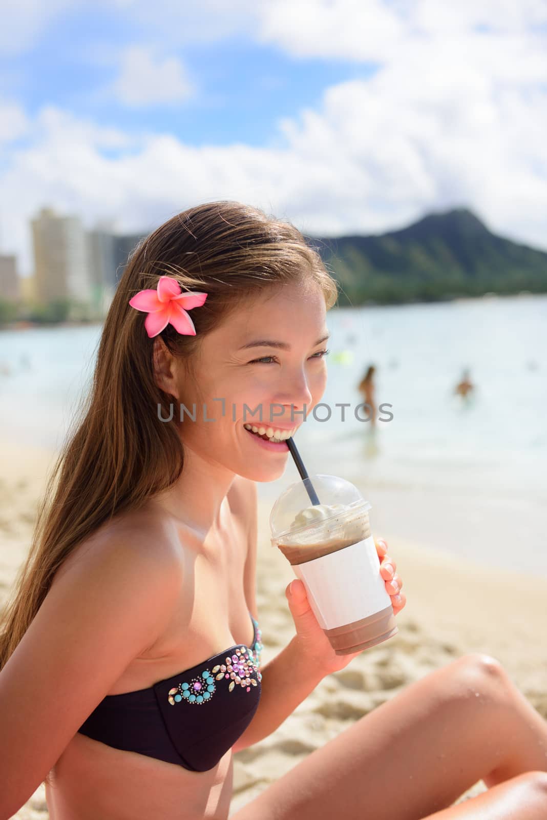 Beach woman drinking iced coffee cappuccino drink by Maridav
