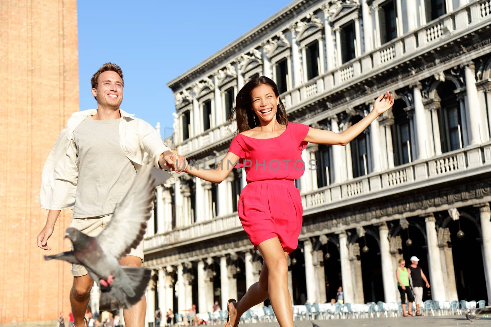 Couple in love having playful fun in Venice by Maridav