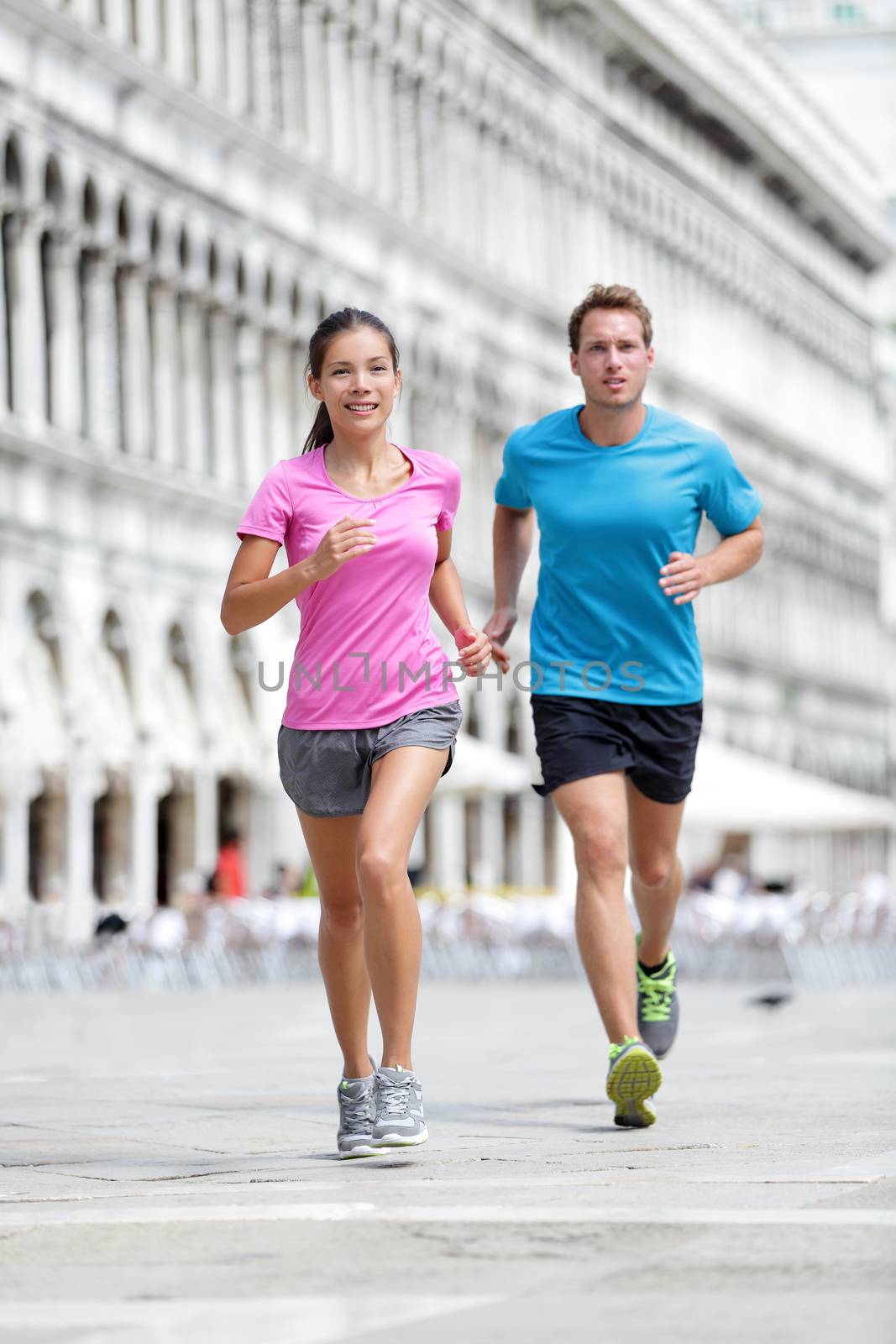 Running runner couple jogging in Venice by Maridav