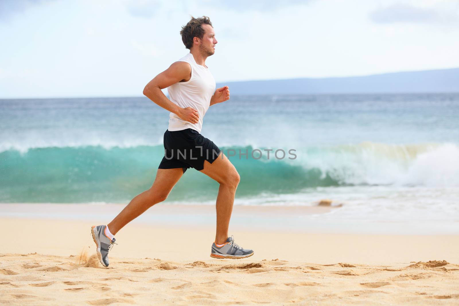 Fitness sports runner man jogging on beach by Maridav