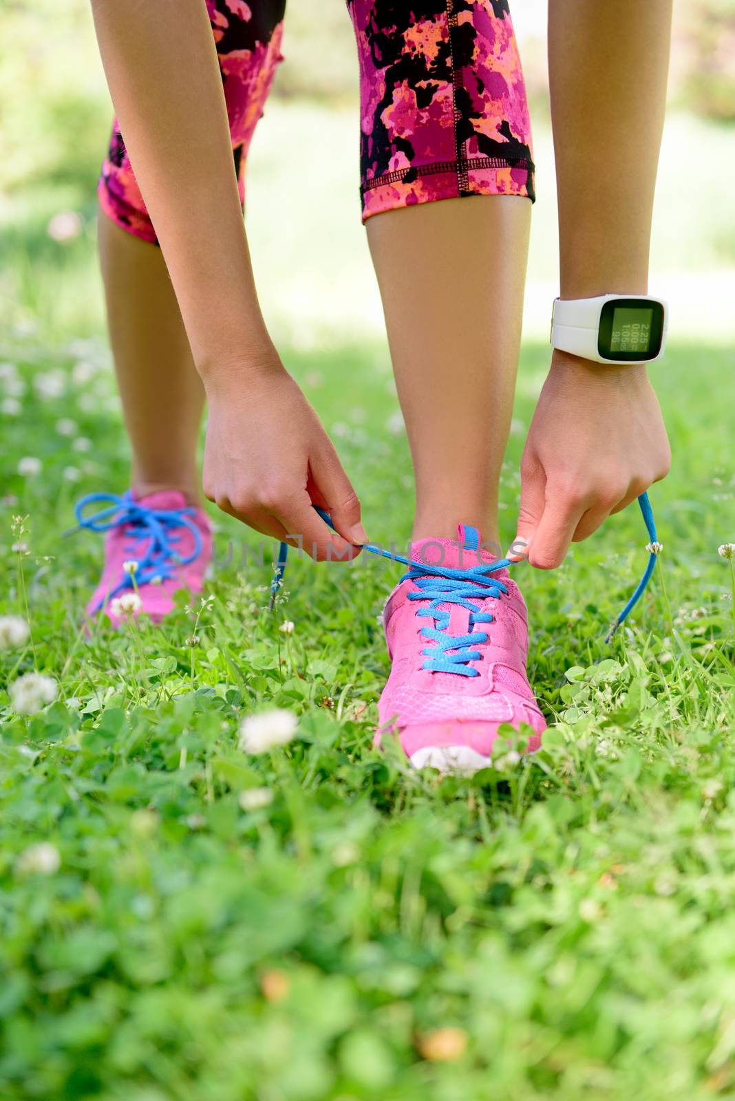 Weight loss - runner tying laces with smartwatch by Maridav