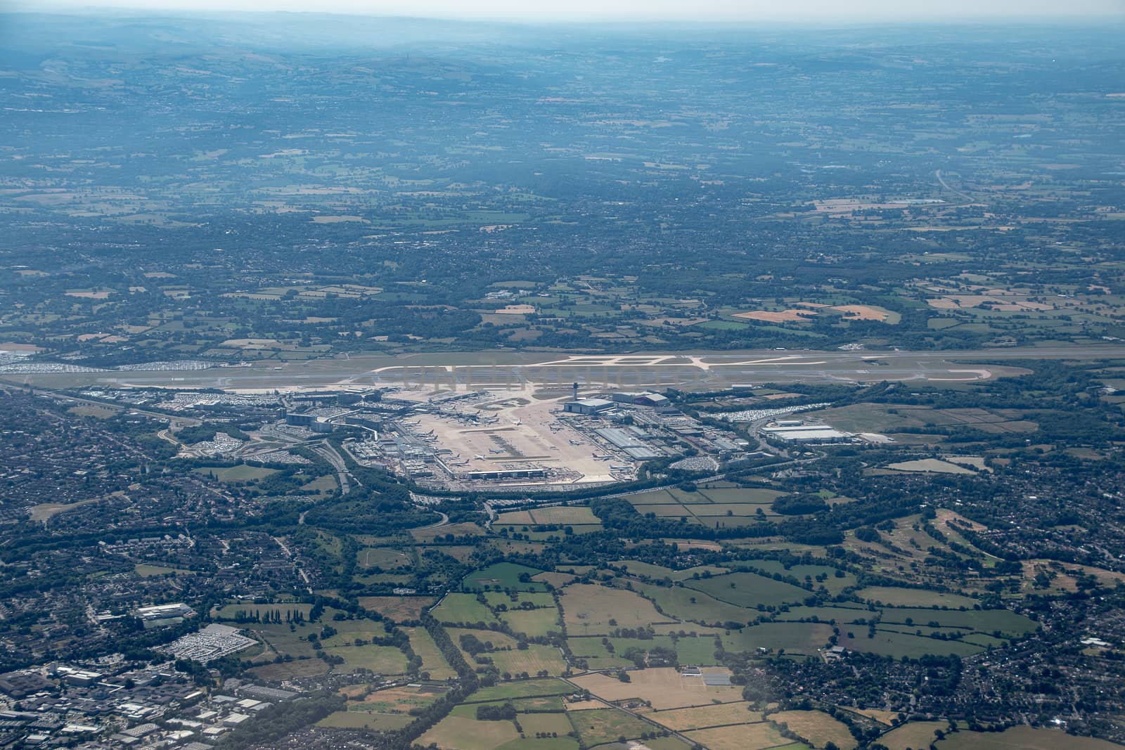 Aerial shot from a plane window of an airport in Manchester