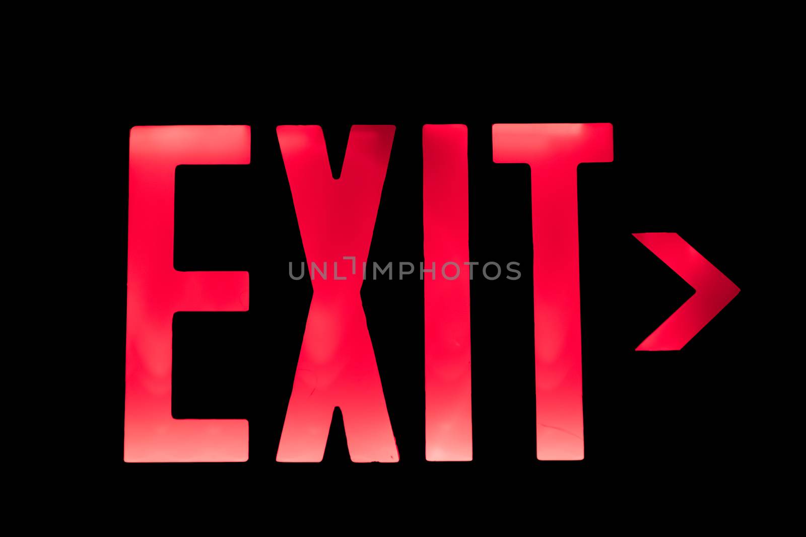 Lit Red Exit Sign pointing to the Right