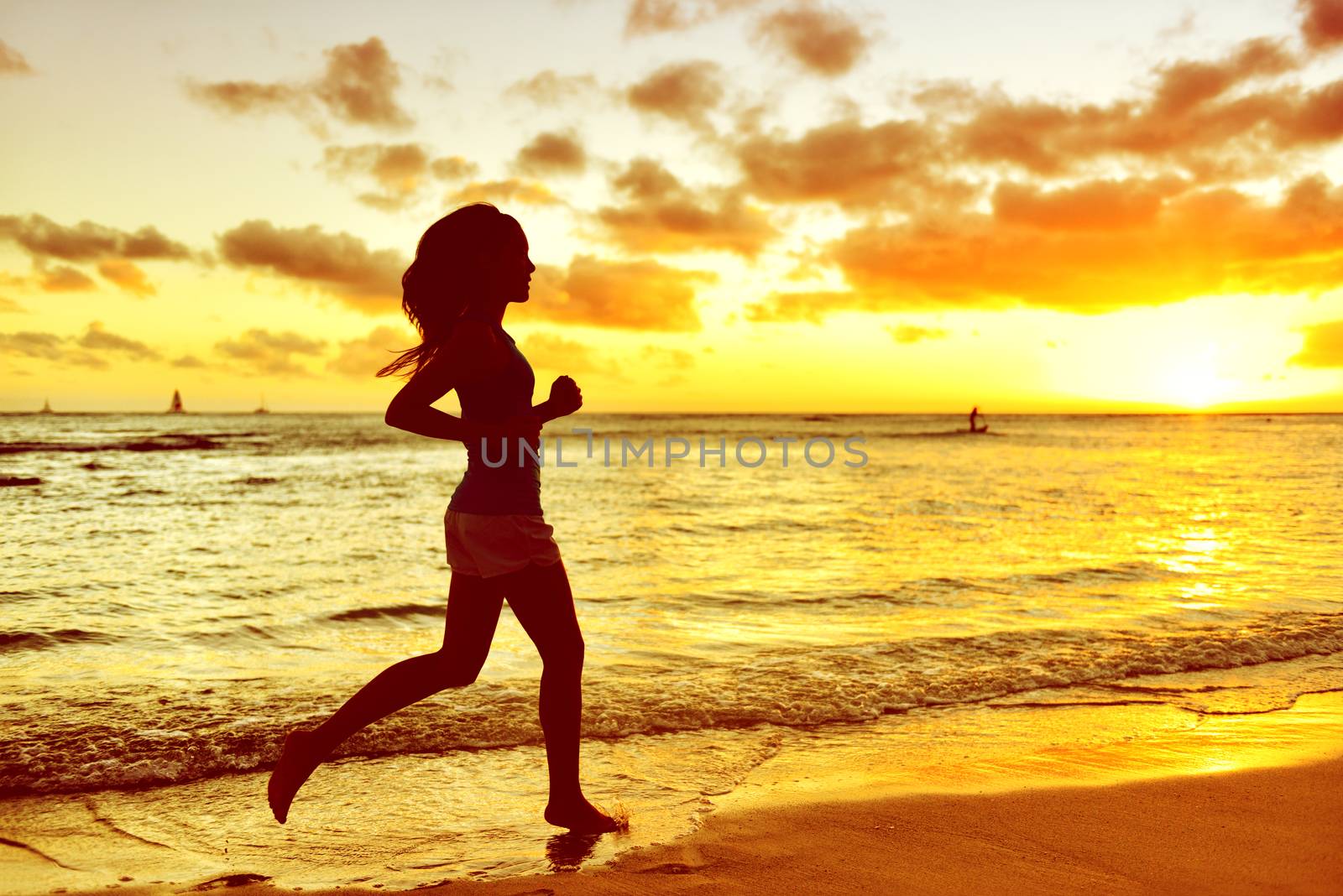 Silhouette Woman Jogging At Beach During Sunrise by Maridav