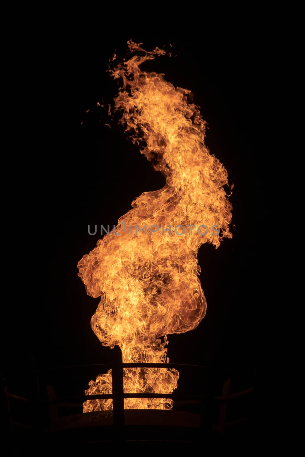 View of fire coming from a large outdoor lantern