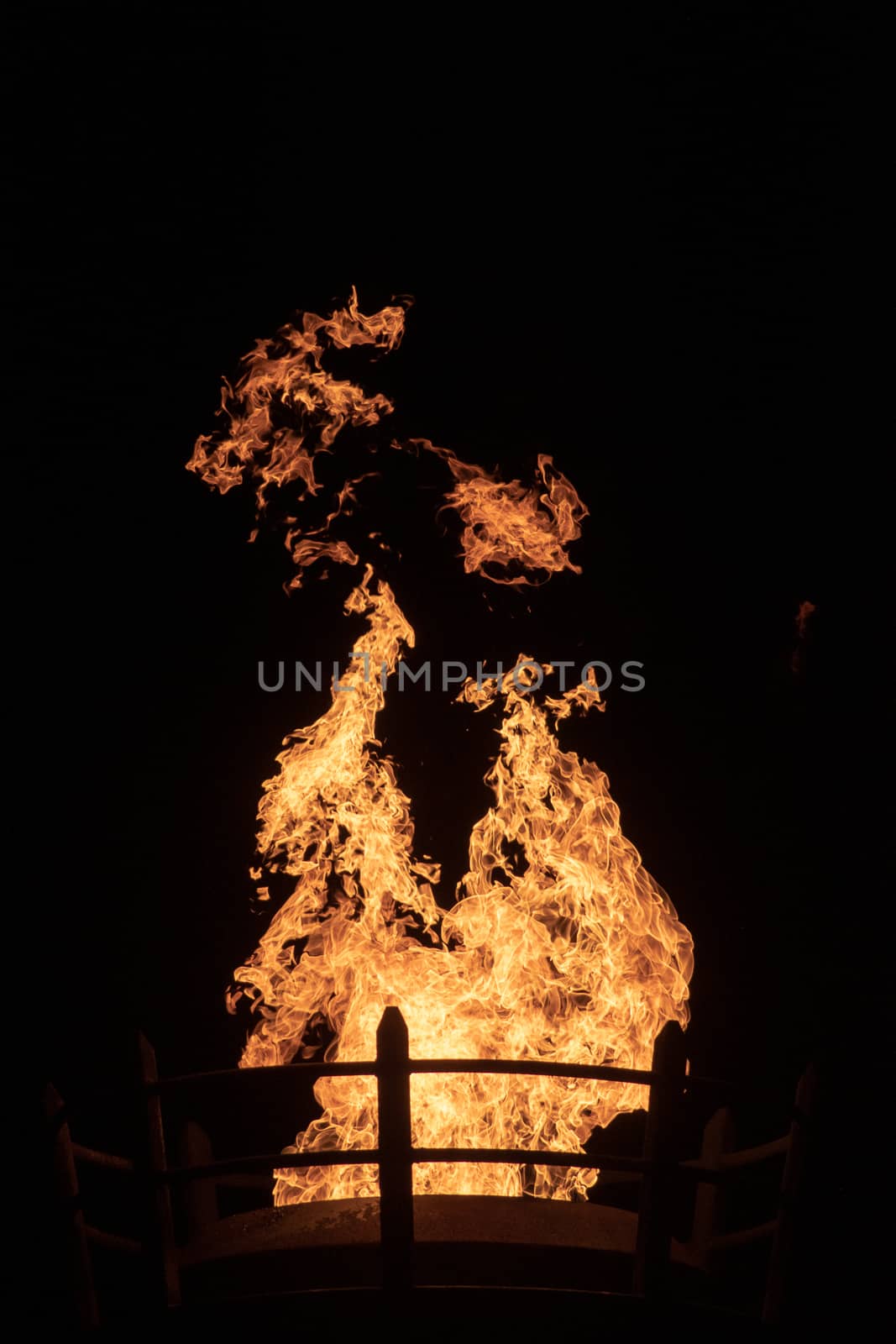 View of fire coming from a large outdoor lantern