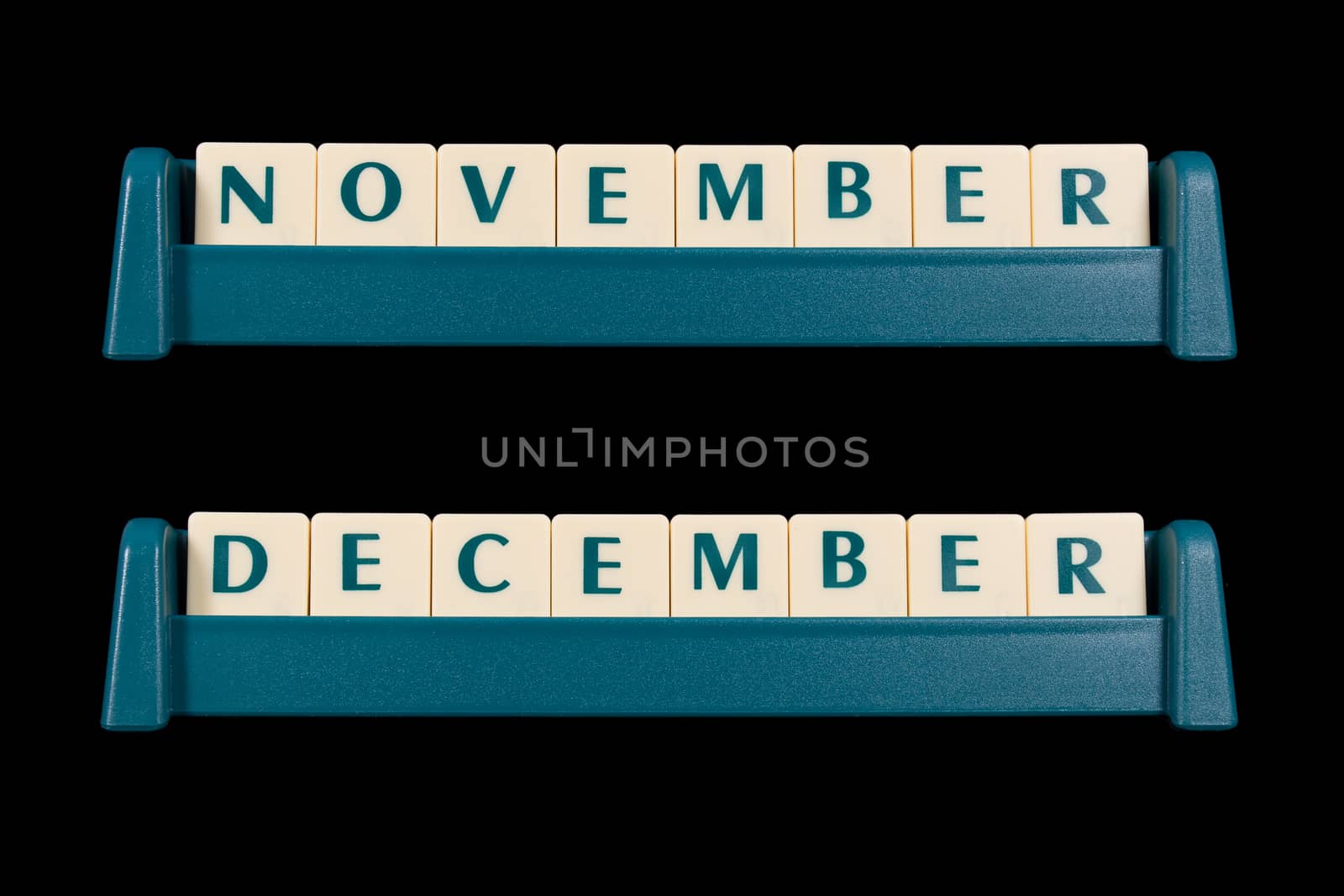 Month title made from game piece tiles. Words include November and December