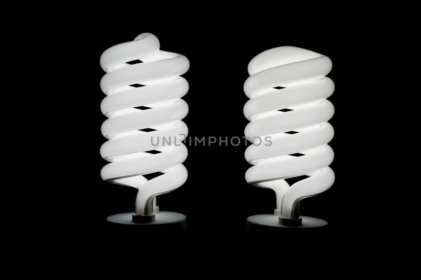 Two low energy spiral light bulbs illuminated