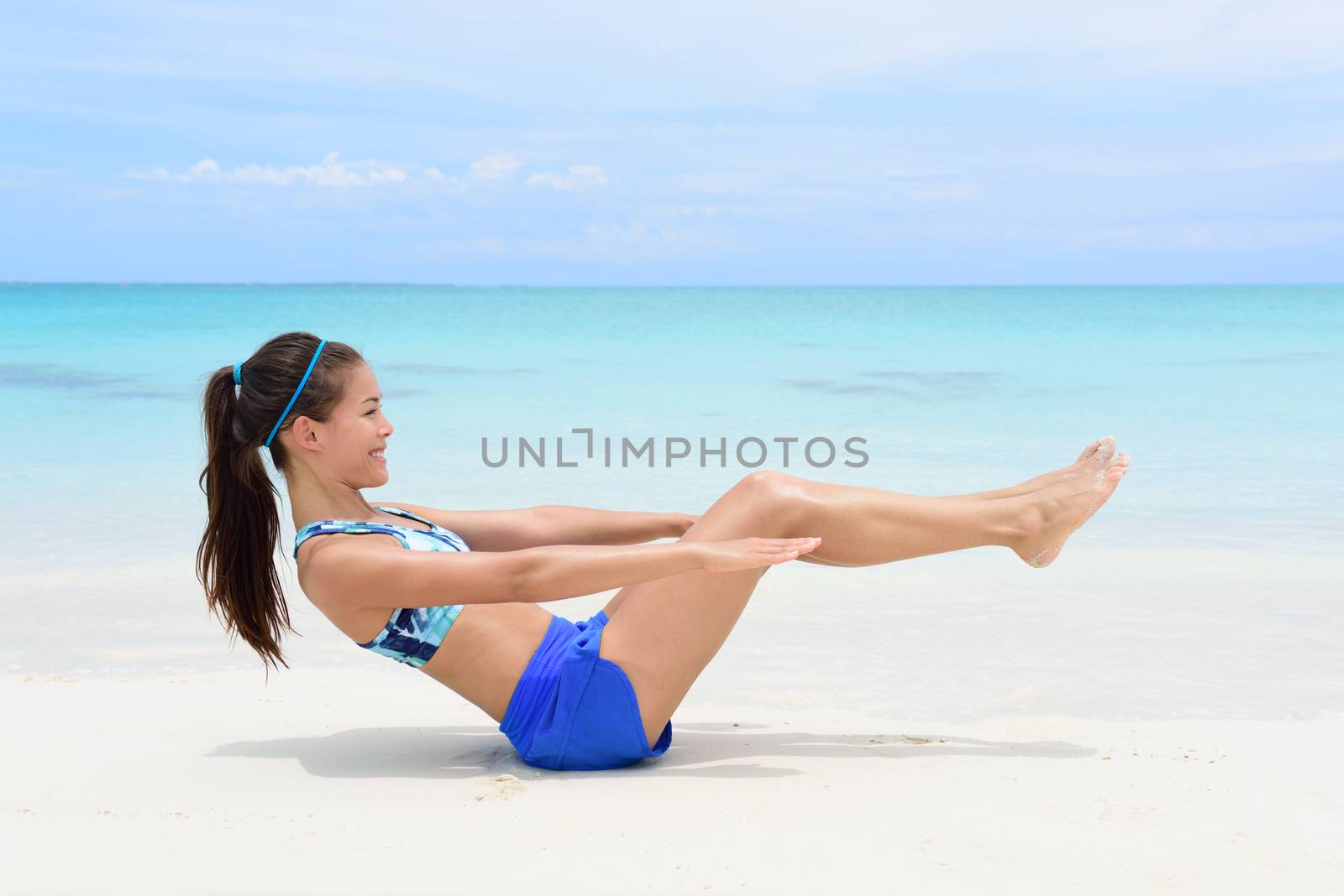 Fitness woman doing v-up crunch ab toning exercise by Maridav