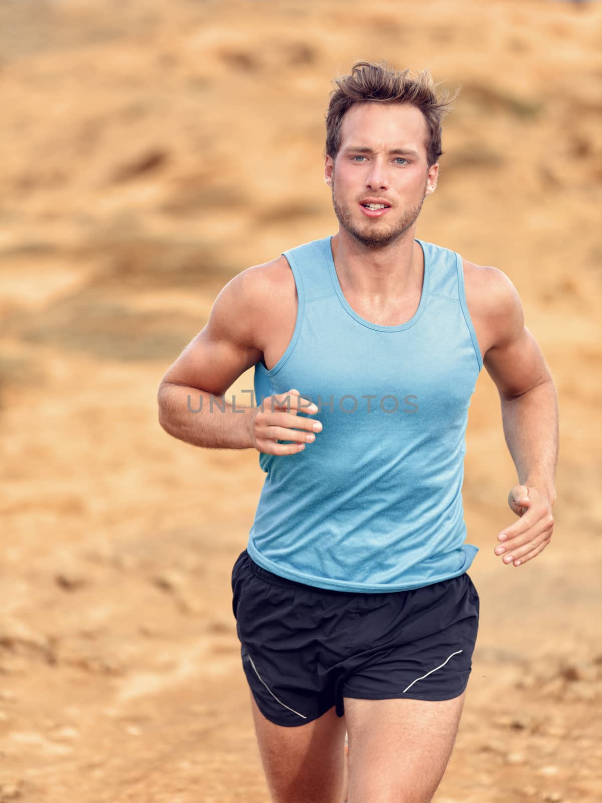 Trail runner training cardio running on mountain by Maridav