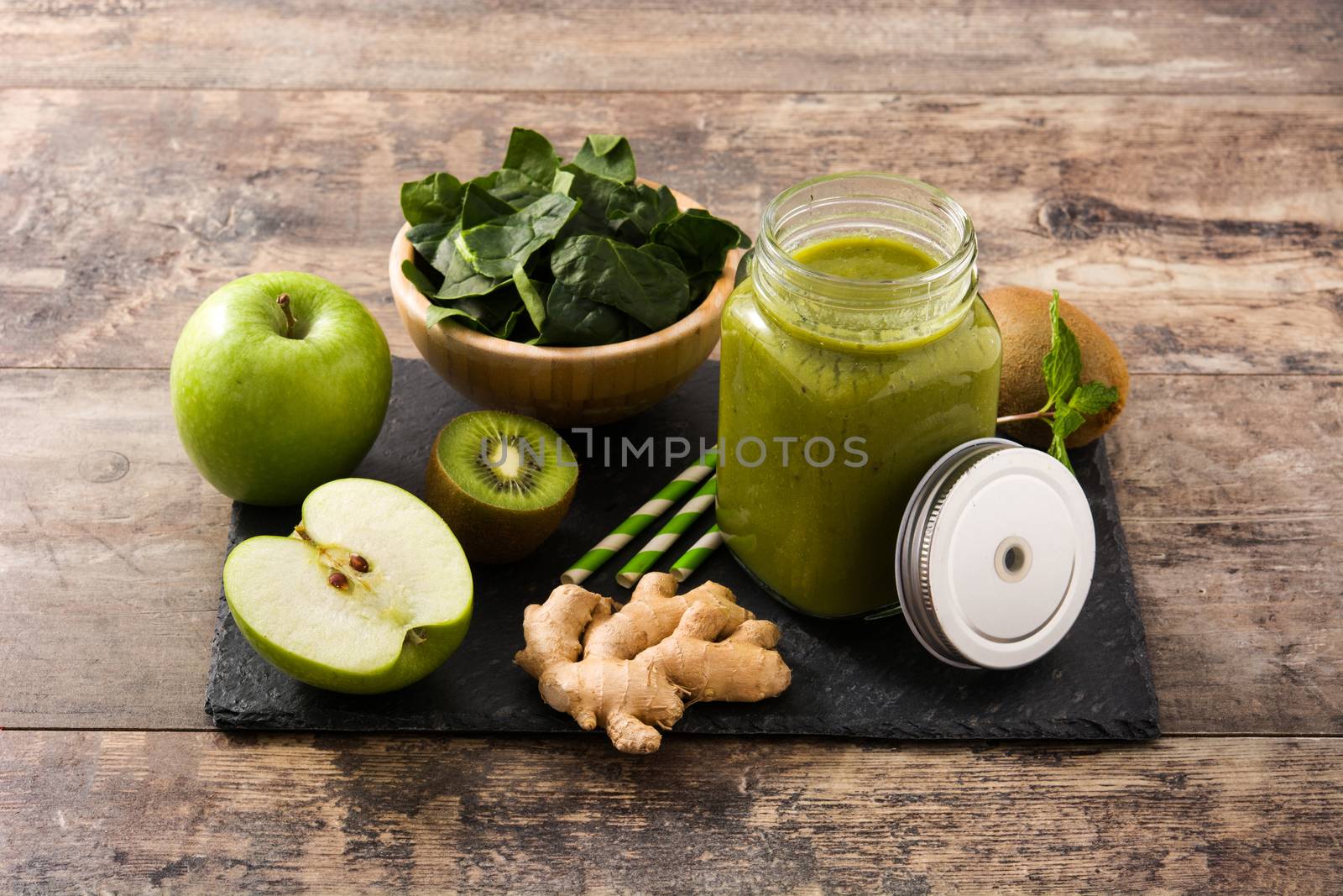 Healthy green smoothie in jar by chandlervid85