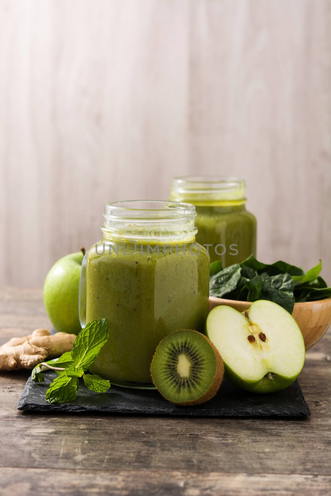 Healthy green smoothie in jar by chandlervid85
