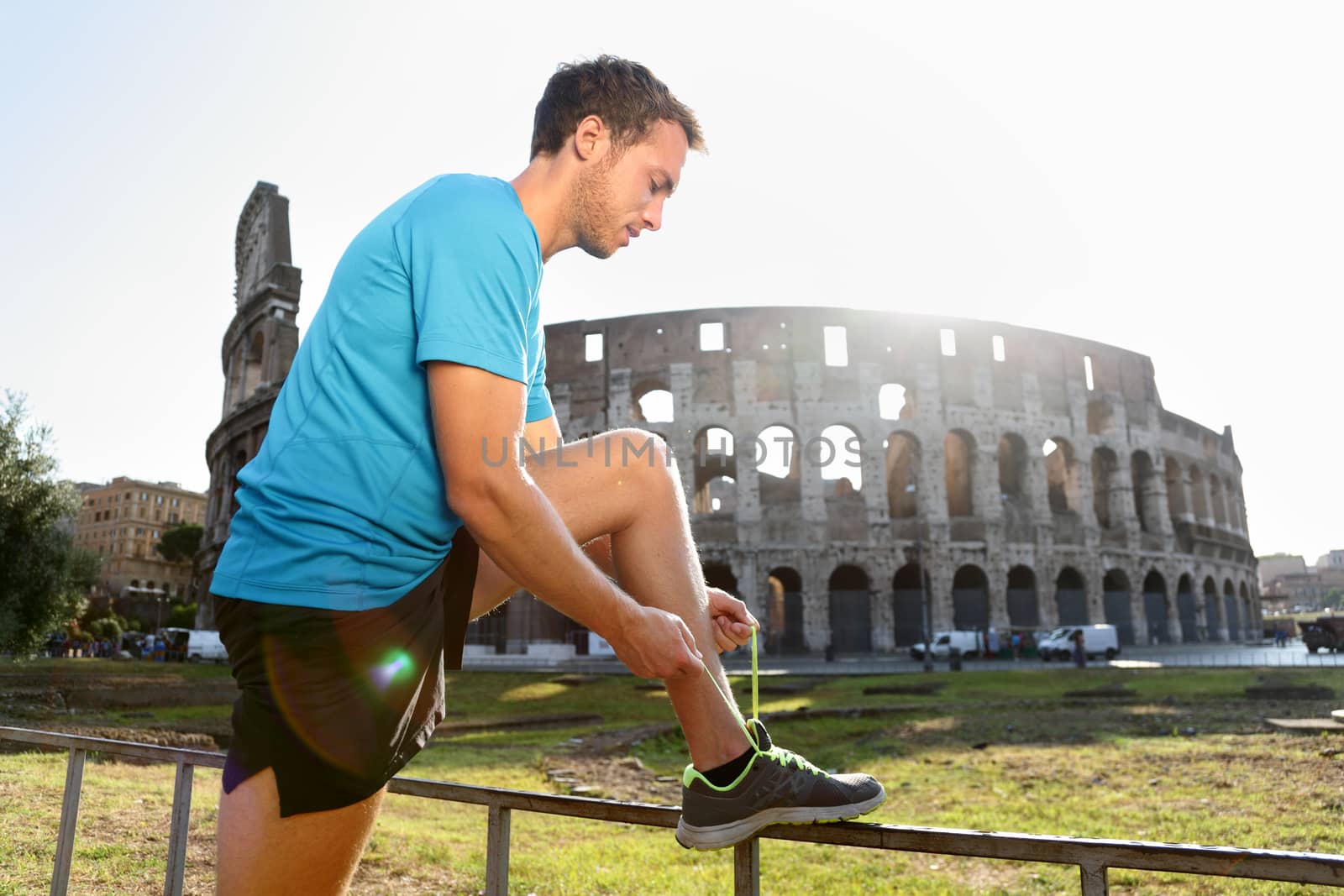 Jogger Running Tying Shoelaces by Colosseum by Maridav