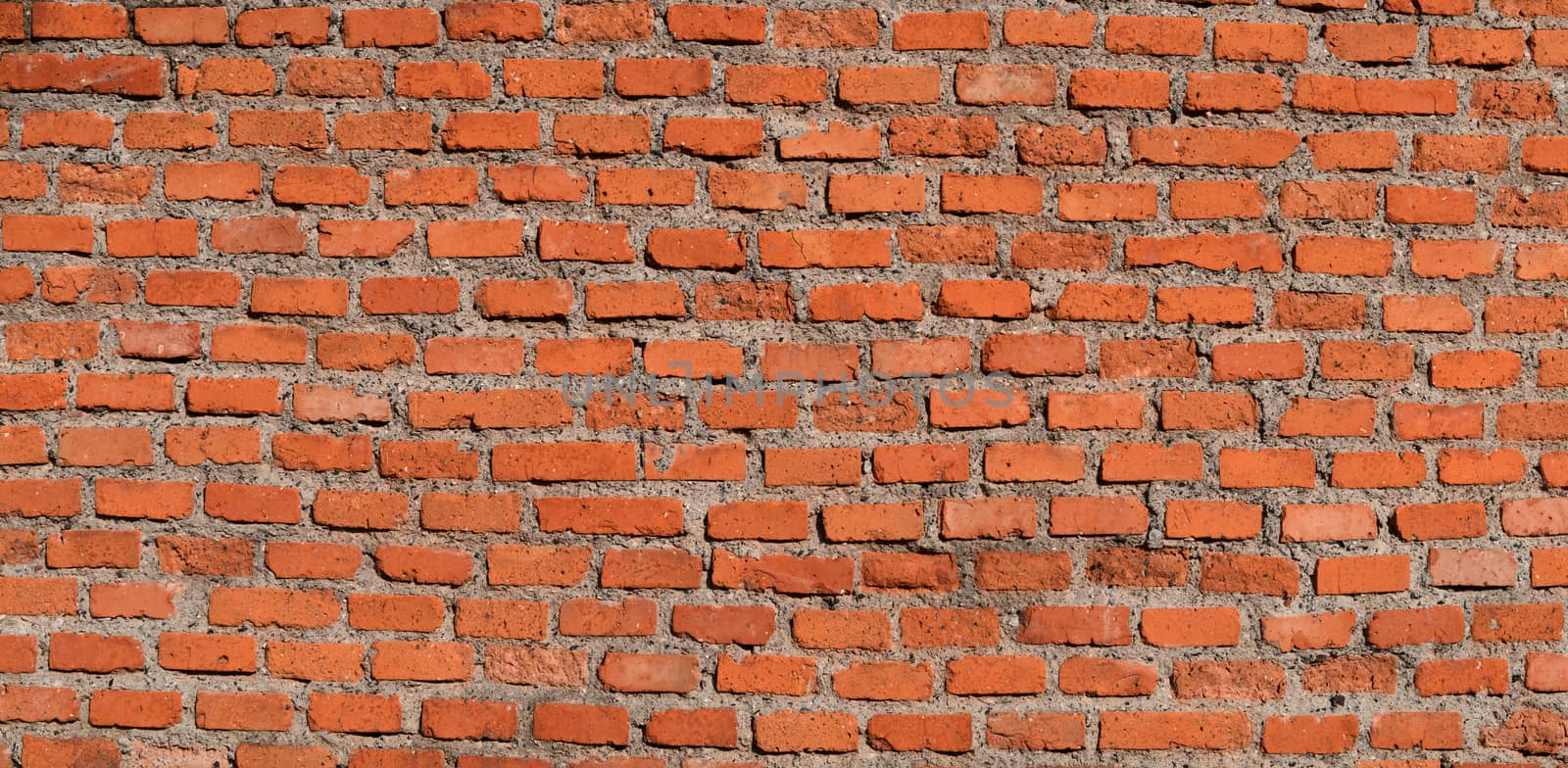 The red brick wall, rough and irregular background. Brick texture.