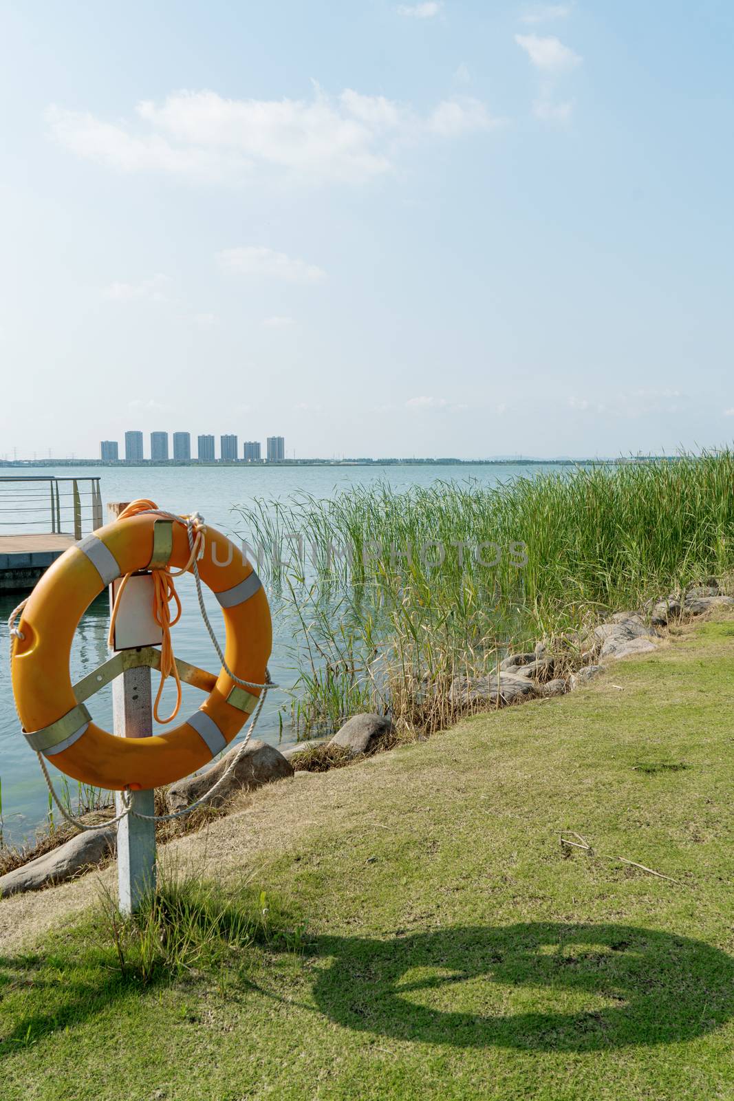 The life buoy by the lake in a public park. Photo in Suzhou, China.