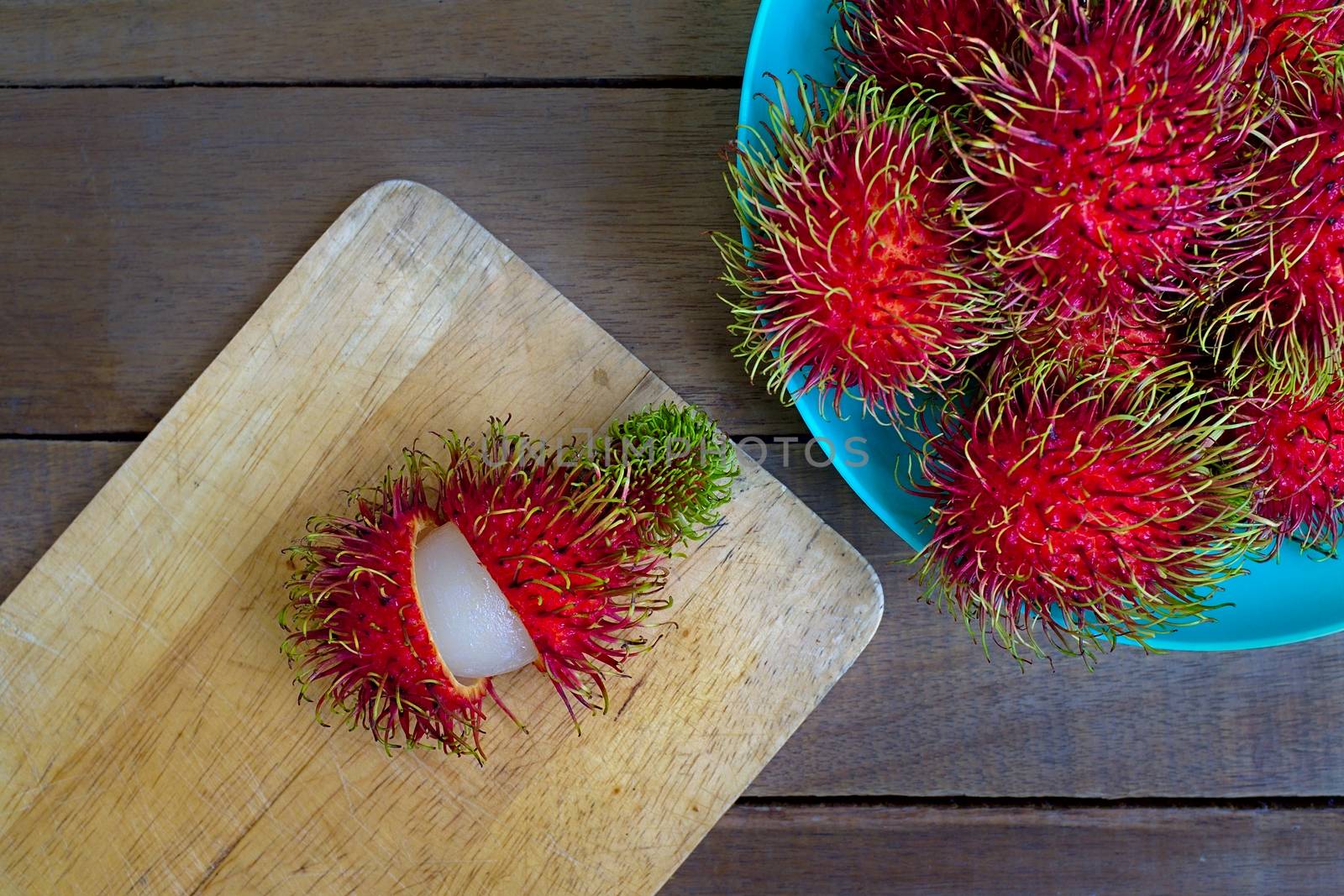 Exotic ripe rambutan fruits from Southeast Asia. Typically found in Indonesia, Malaysia, Thailand and the Philippines.