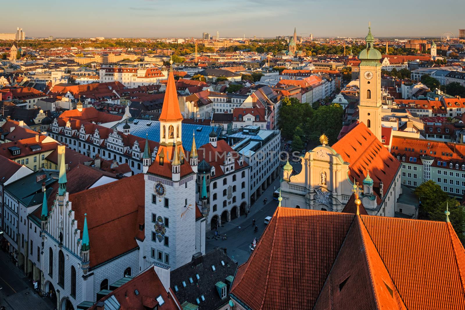 Aerial view of Munich - Marienplatz and Altes Rathaus from St. Peter's church on sunset. Munich, Germany