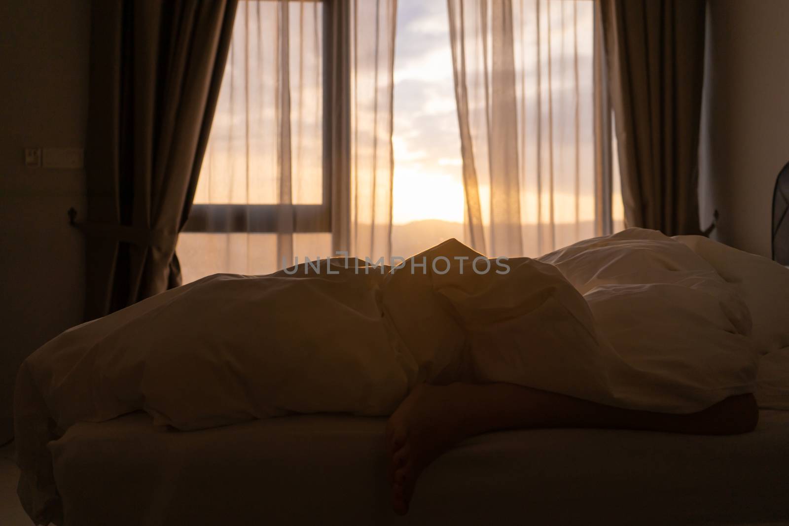 Foot sleeping in the morning at dawn, the girl hangs down the bed. Spy photo. Deep sleep. by Try_my_best