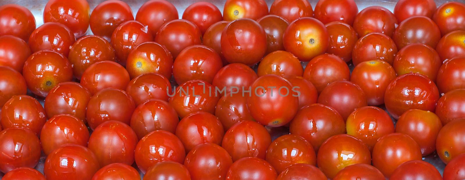 closeup of lots of red cherry tomatoes by sirspread