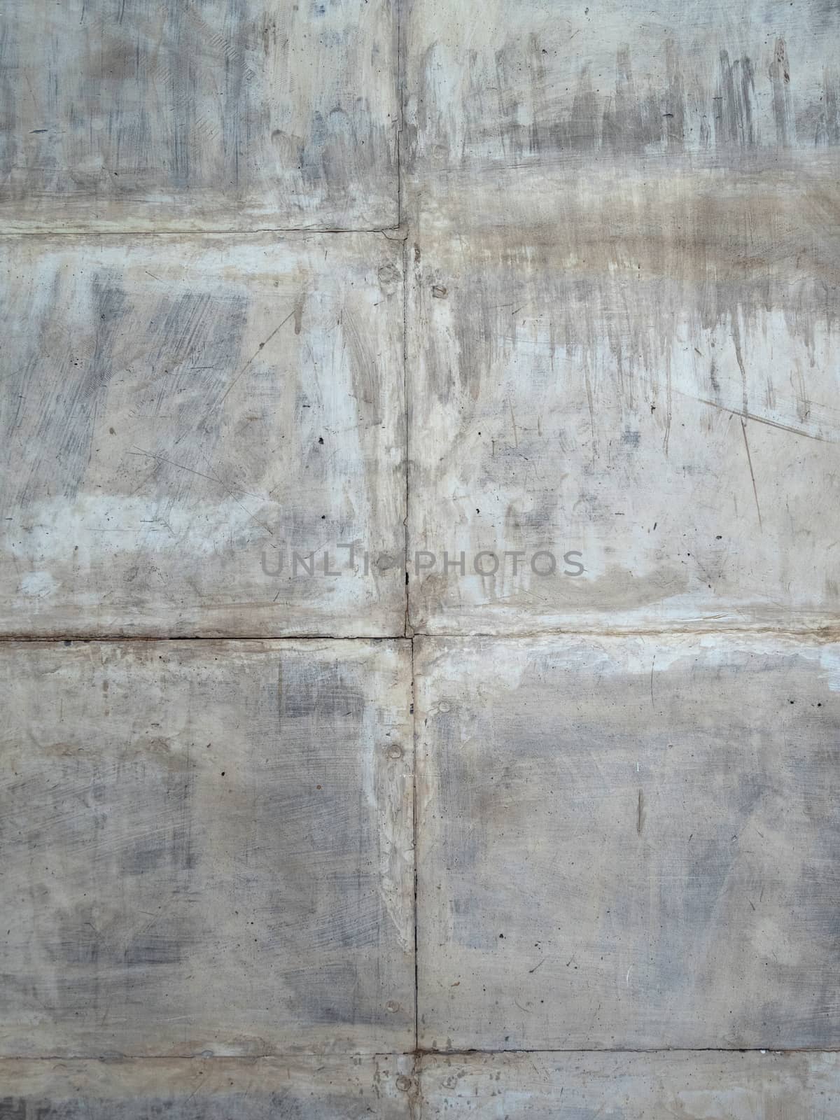 Concrete gray scratched wall of square blocks. by Sid10