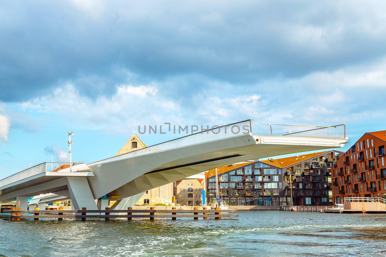 Drawbridge in Copenhagen close up. Modern drawbridge in central Copenhagen near Nyhavn pier. Cityscape of Copenhagen, view on the drawbridge leading to popular street of Nyhavn in Copenhagen, Denmark.