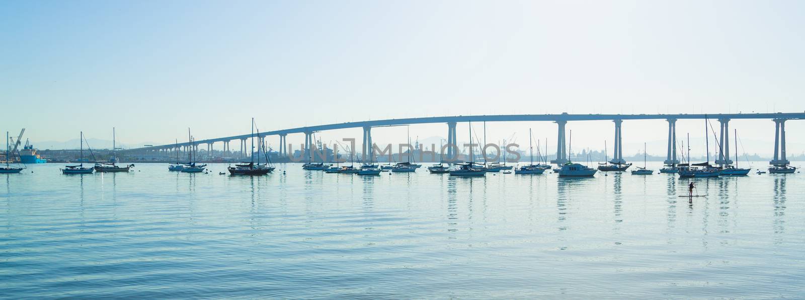 San Diego Coronado Bridge. San Diego waterfront with sailing Boats - Industrial harbor and Coronado Bridge.