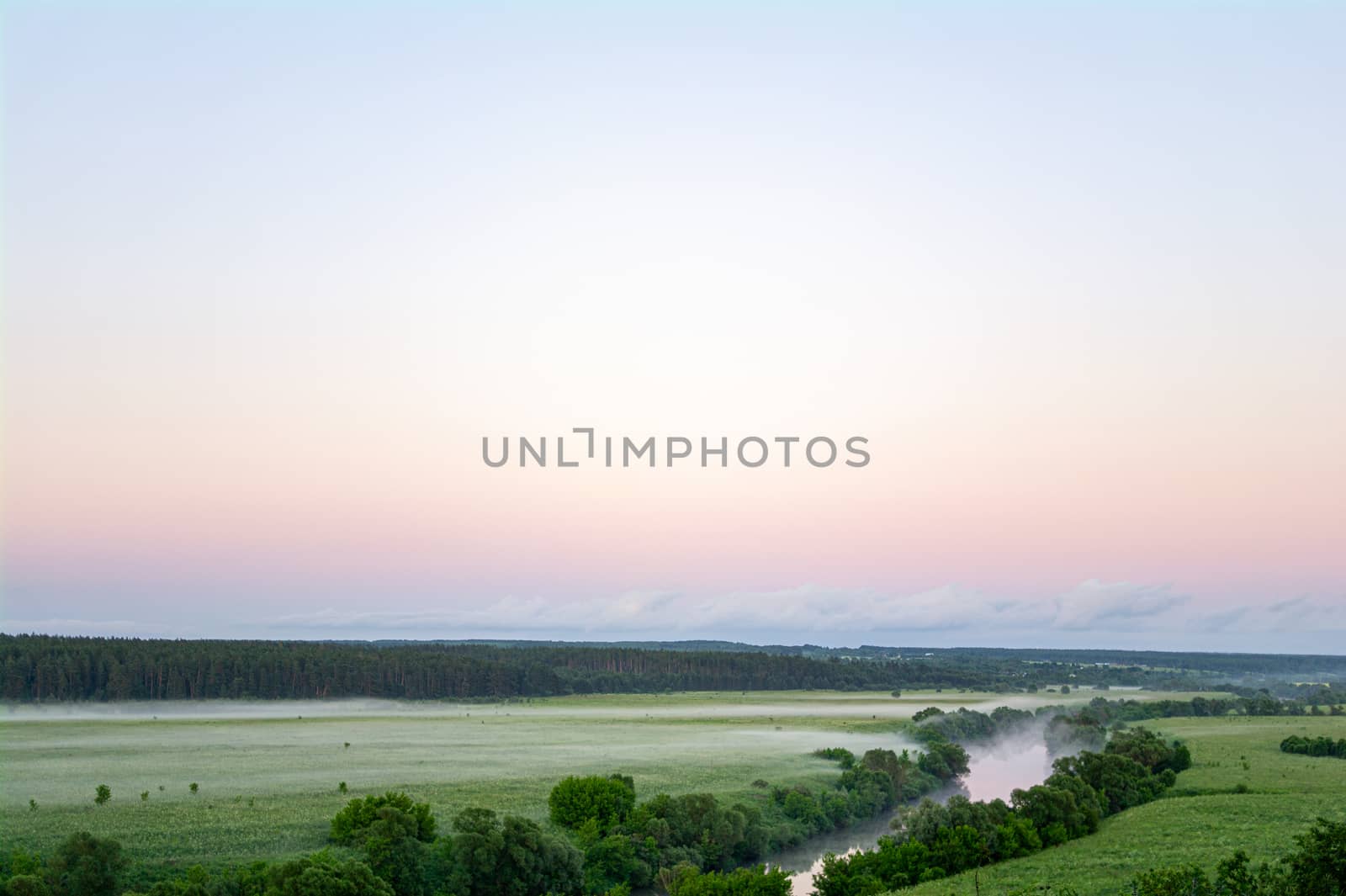 Landscape with river and trees, fields and clouds.