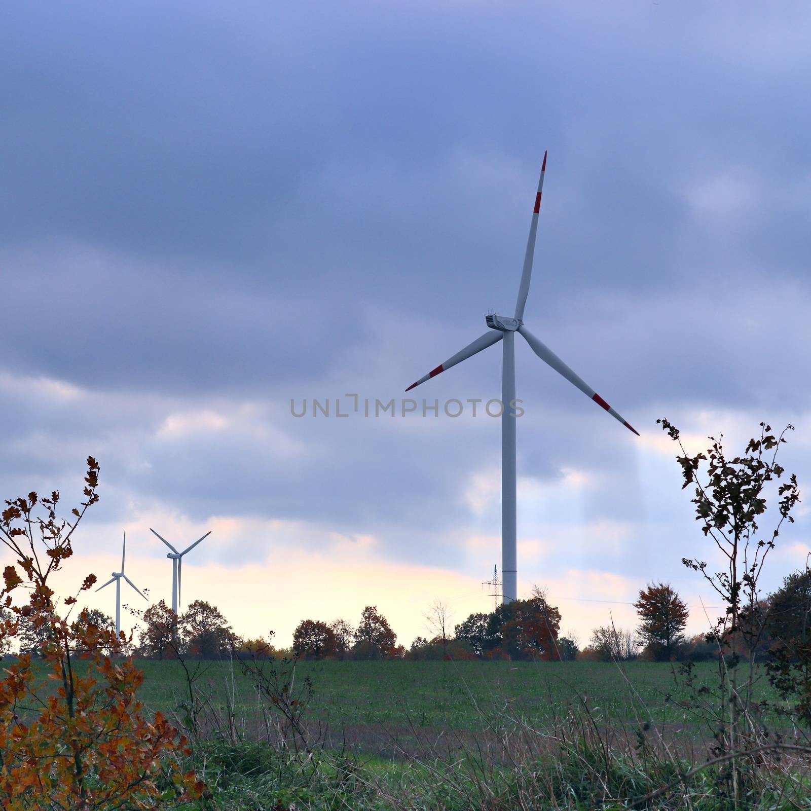 Panoramic view on alternative energy wind mills in a windpark