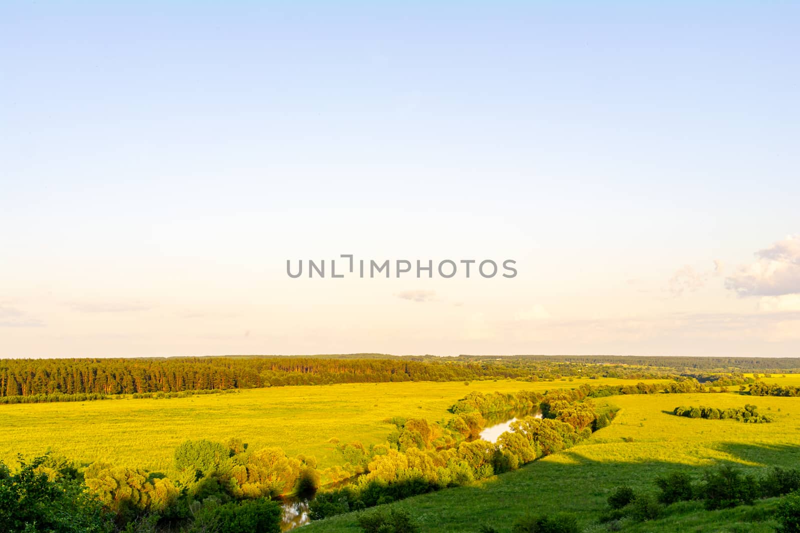 River and fields in the afternoon sun.