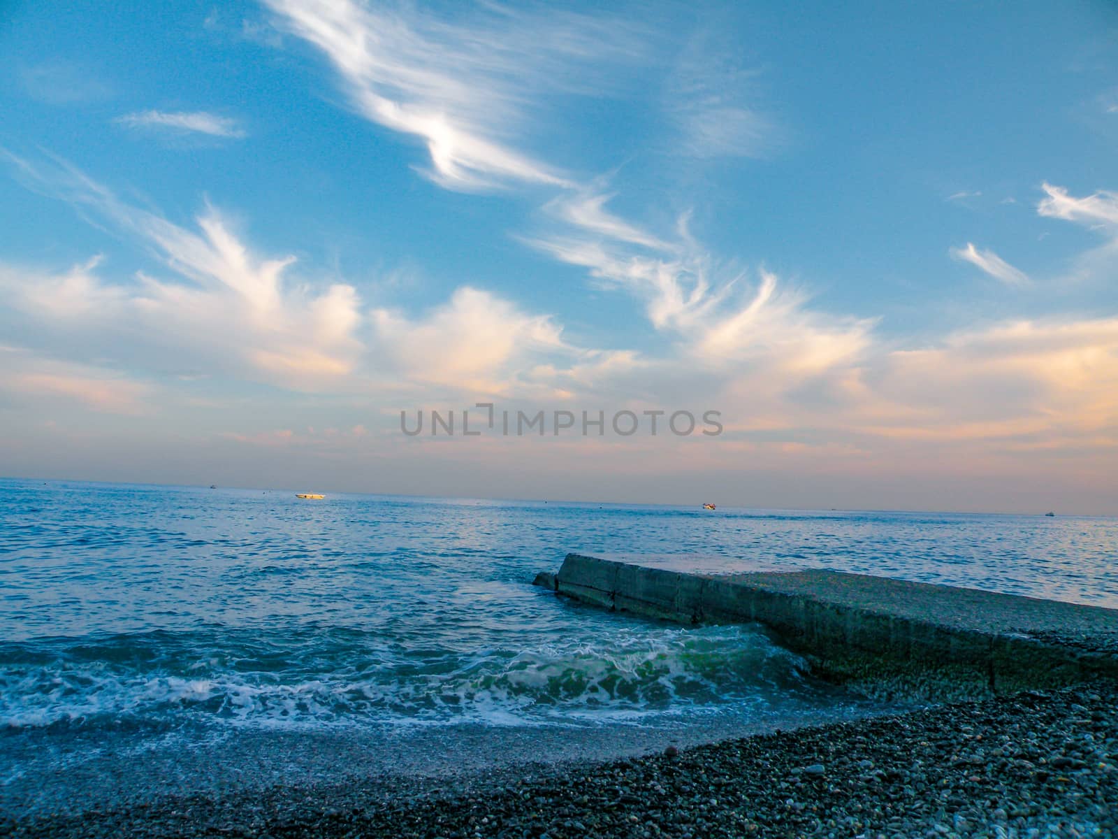 Old concrete pier on sea for swimming in the evening sunset by mtx