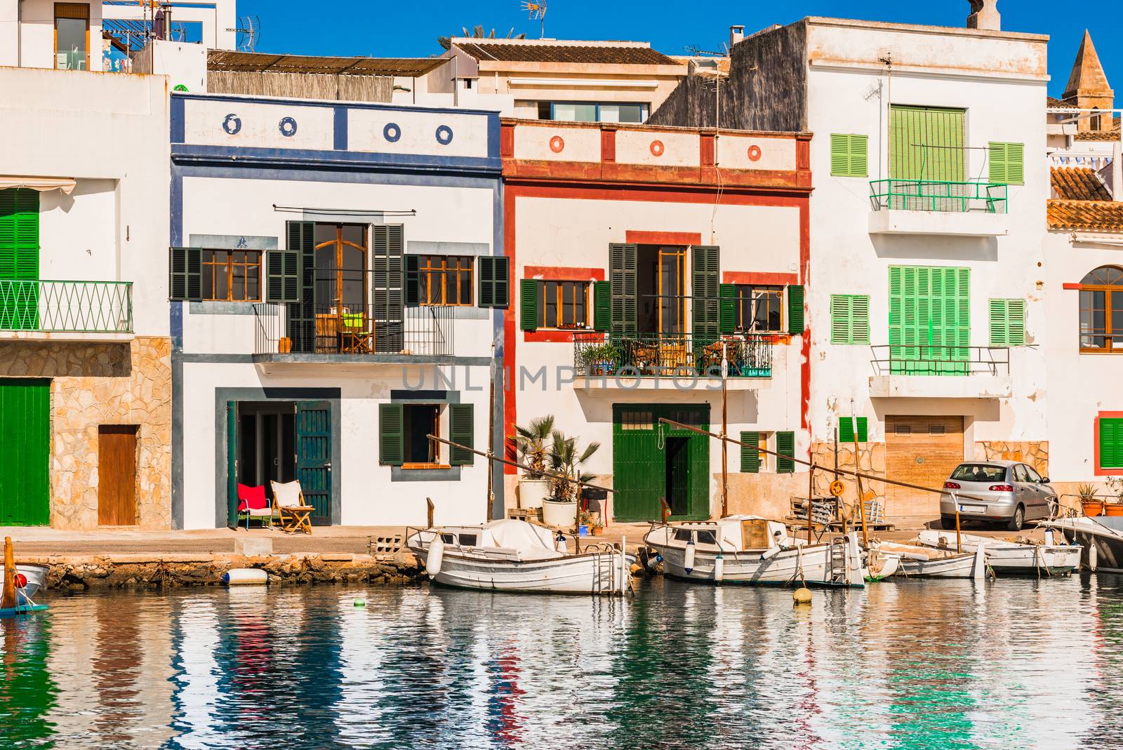View of Porto Colom harbour village with colorful houses on Majorca, Spain  by Vulcano