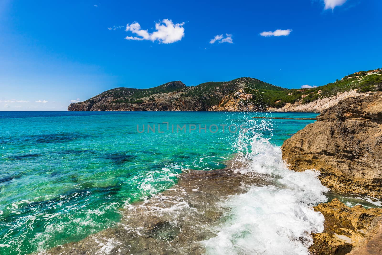 Wave breaking on rocky coast by Vulcano