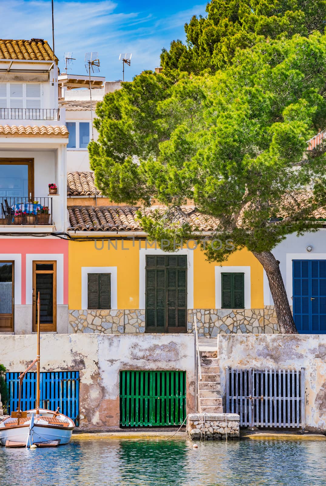 Colorful houses at the harbor of Porto Colom, Majorca Spain by Vulcano