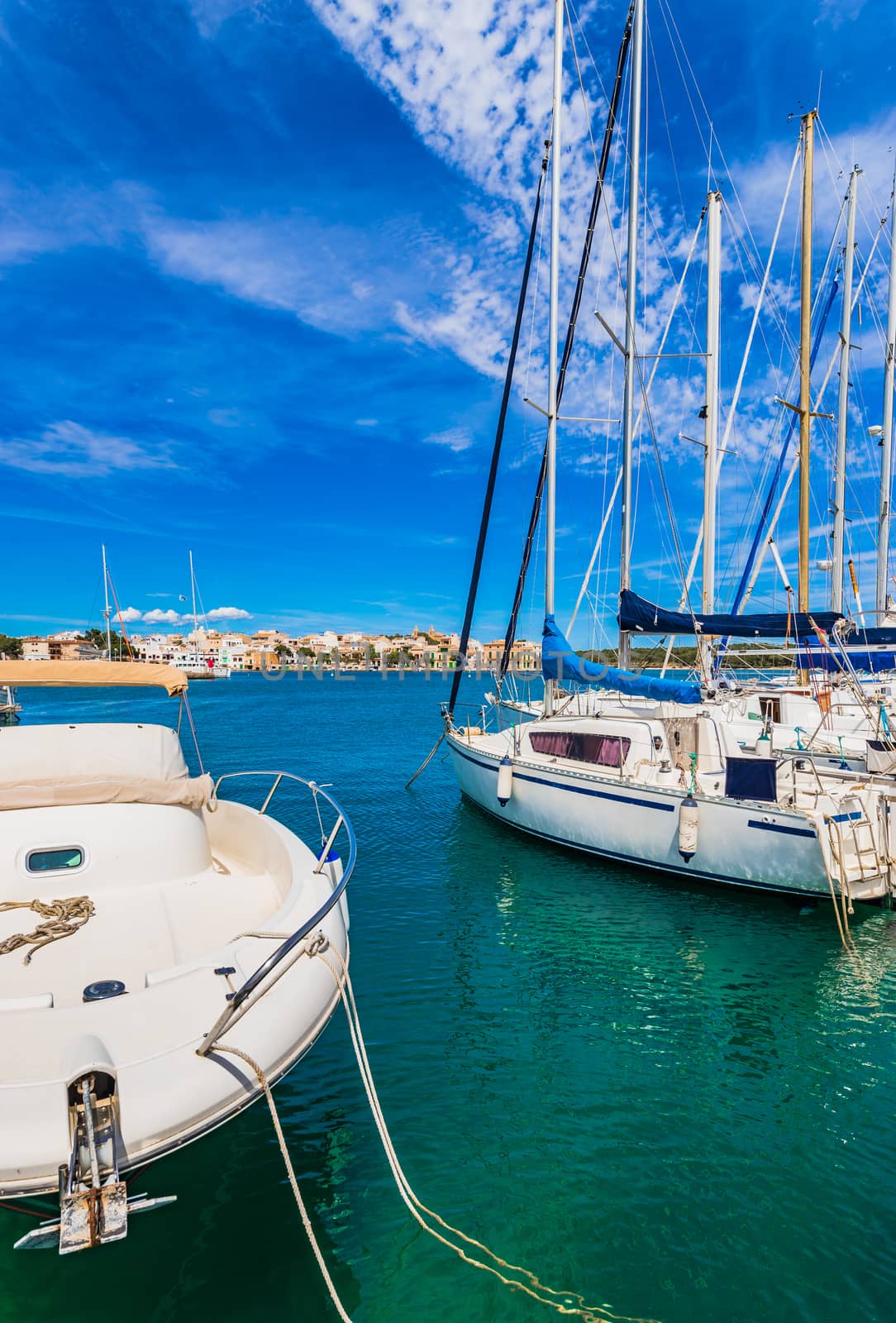 Marina harbor with moored sailing yachts in Porto Colom, idyllic coast on Mallorca island, Mediterranean Sea