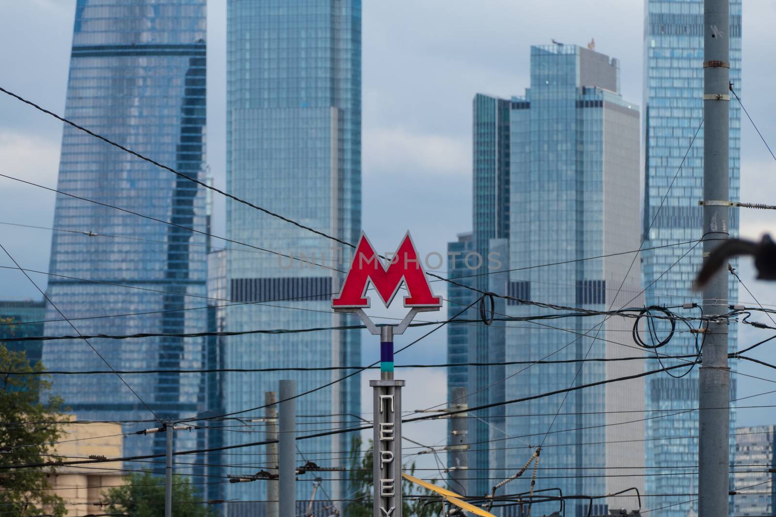 Symbol M underground transport and skyscrapers Moscow City