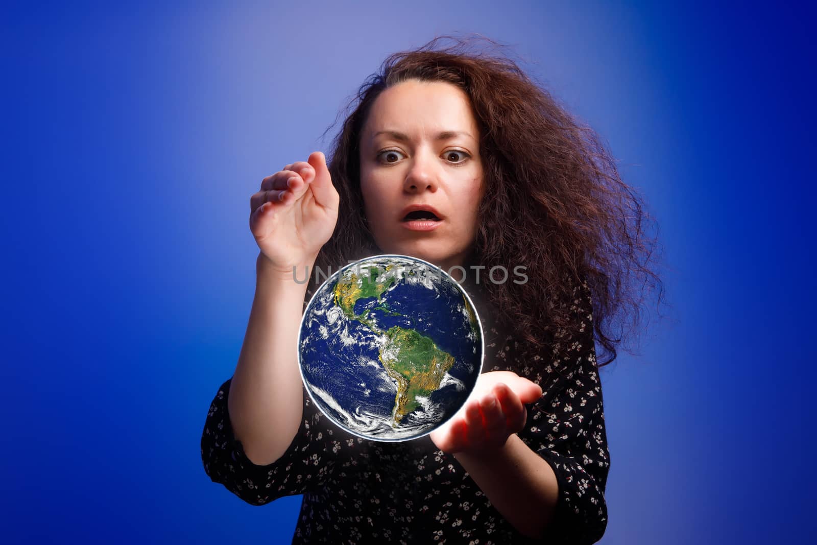 Girl holding a earth globe in her hands. Save Earth Environment. by 9parusnikov