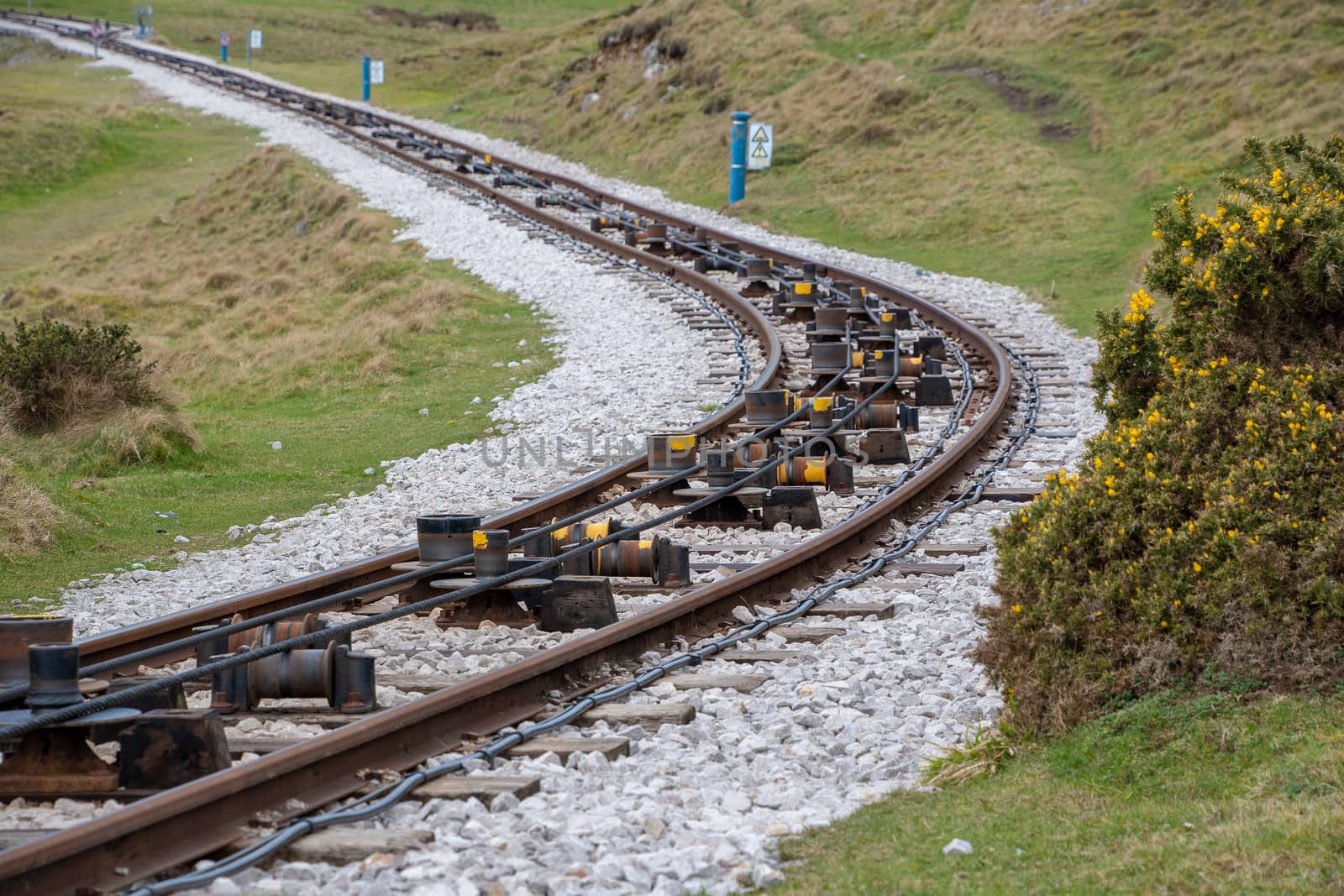 Close view of tram rail tracks showing the cable system which pulls the trams along