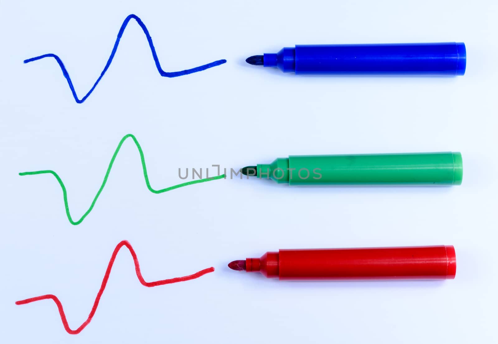 Hand drawn blue, green and red line and pens isolated on a white background