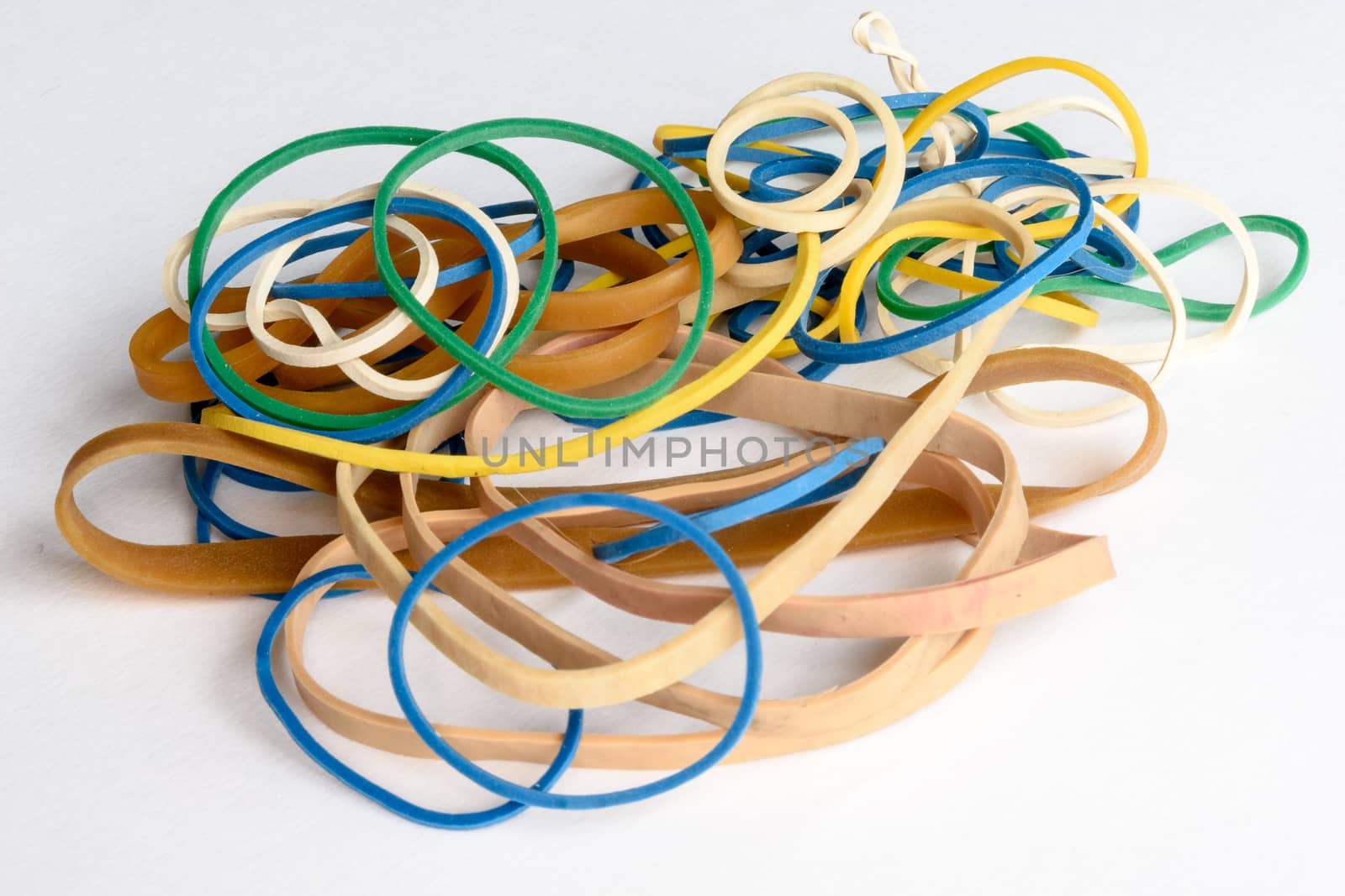 close up view of different coloured rubber bands