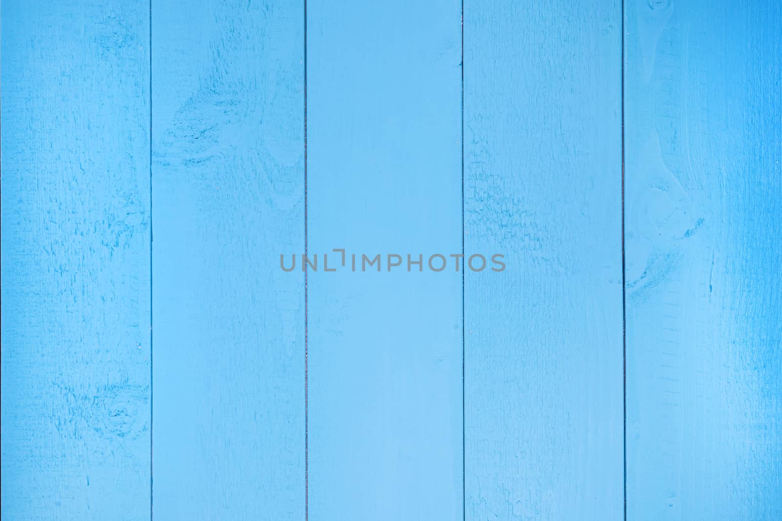 a top view surface formed by blue wooden planks