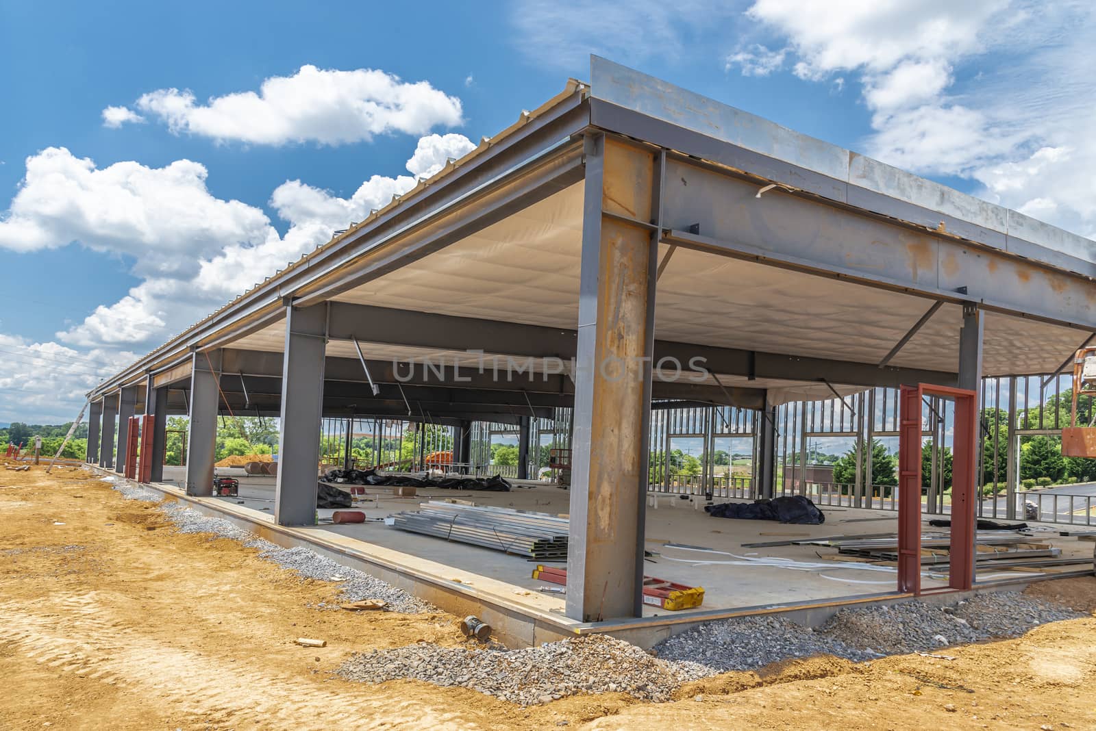 Horizontal shot of a commercial contruction project with a view of the interior.