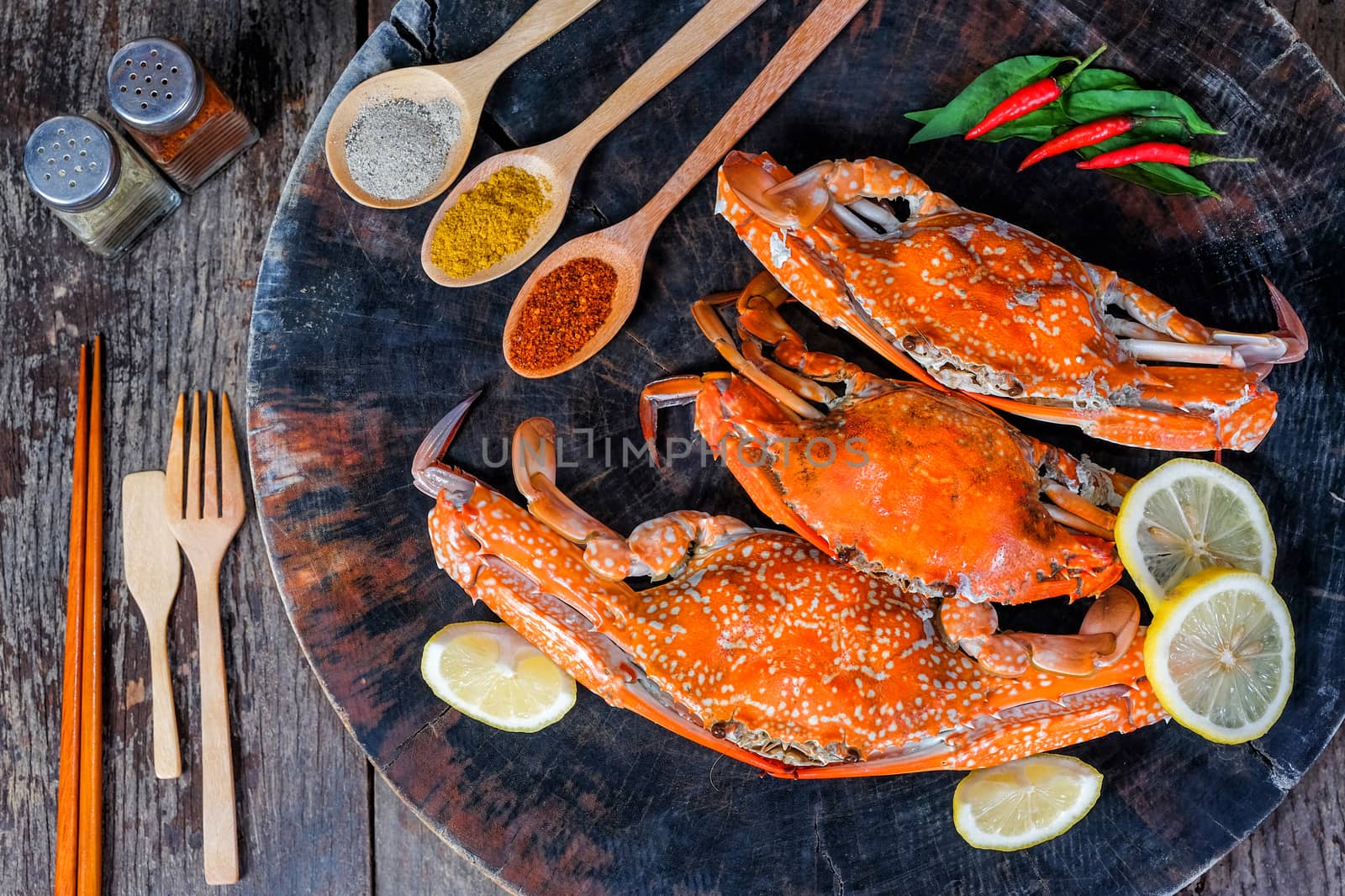 jumbo crab and spices herb on dark background